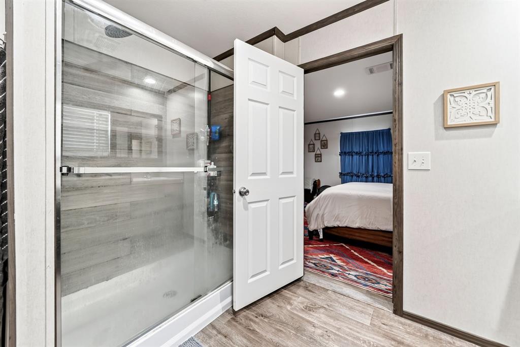 660 VZ County Road Canton, TX 75103 - Photo 30 of 39 Glass-enclosed shower with wood-finish wall panels