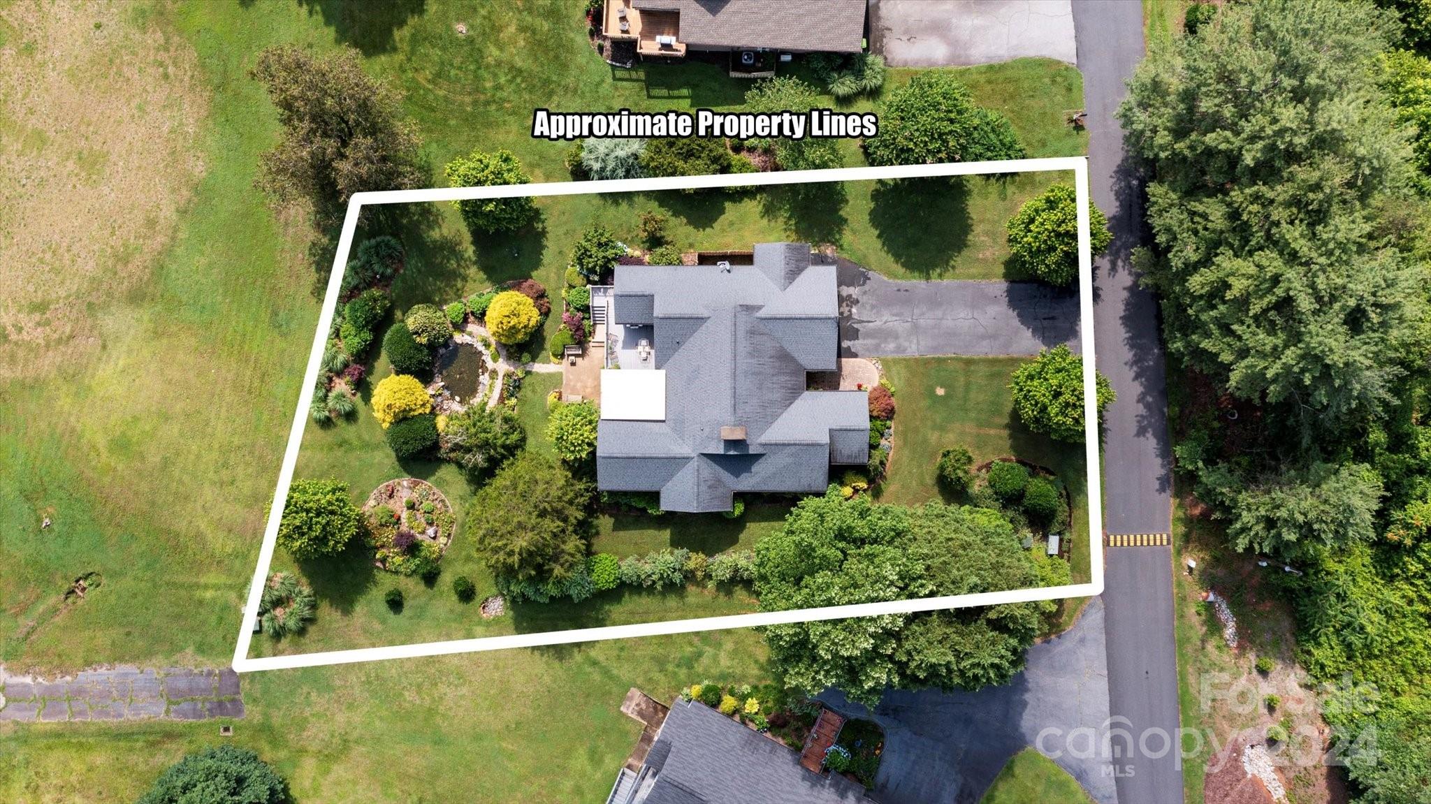 990 Club Road Tryon, NC 28782 - Photo 4 of 30 an aerial view of a house with a garden