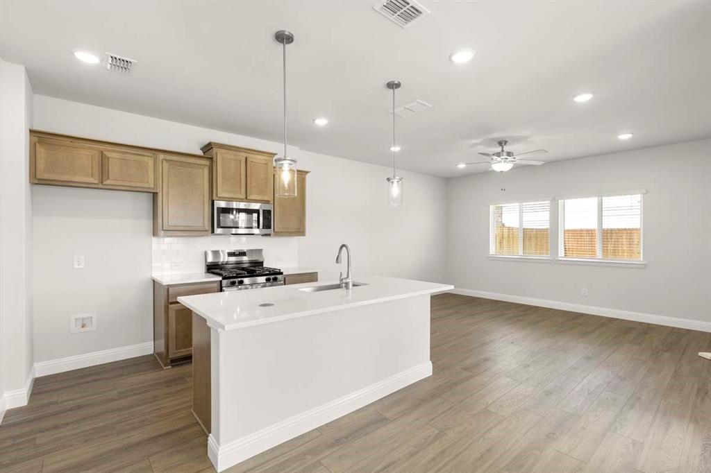 451 Sweet Spring Drive Lavon, TX 75166 - Photo 7 of 33 07-451-sweet-spring-lavon-tx-kitchen-island