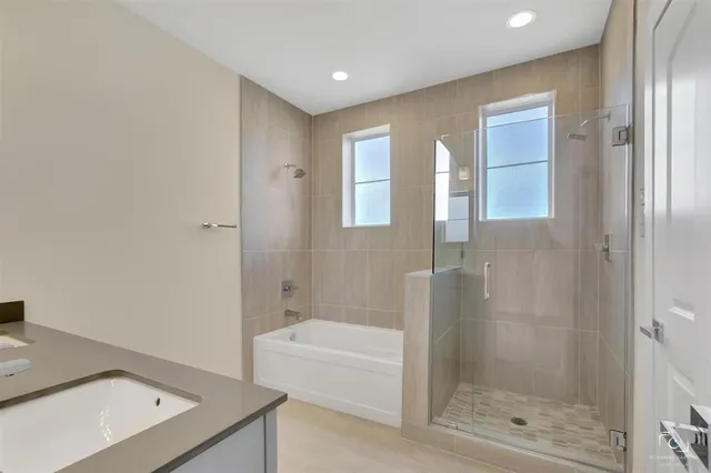 a bathroom with a bathtub and a shower