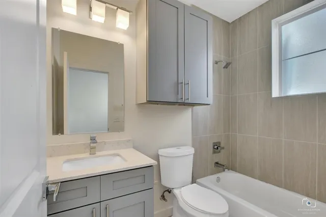 a bathroom with a sink toilet and vanity