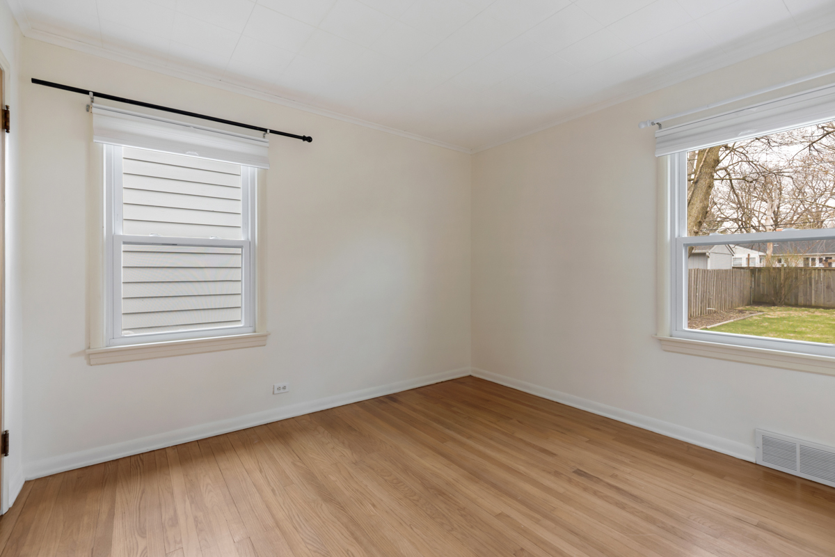 610 High Street Geneva, IL 60134 - Photo 11 of 18 a view of an empty room with wooden floor and a window