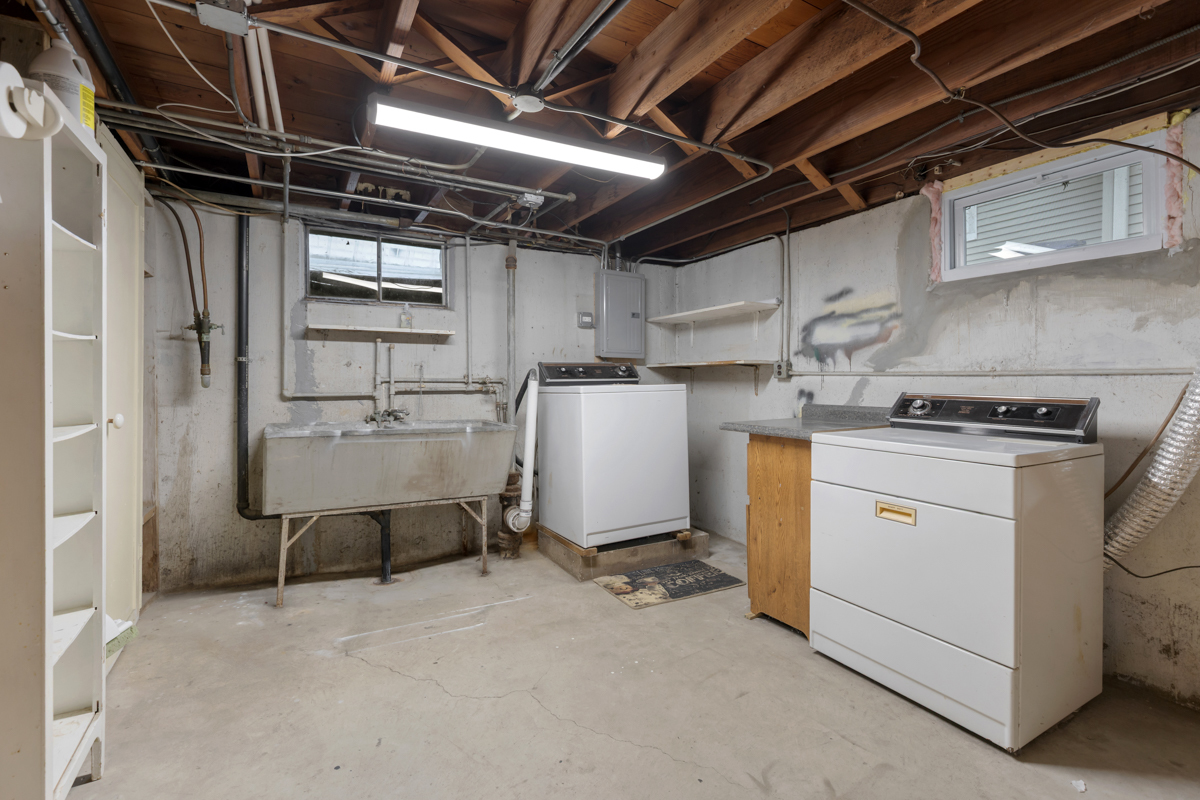 610 High Street Geneva, IL 60134 - Photo 14 of 18 a utility room with cabinets dryer and washer