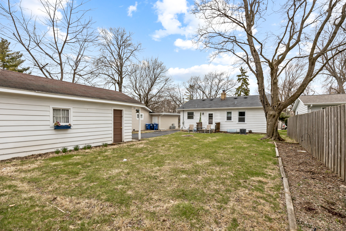 610 High Street Geneva, IL 60134 - Photo 18 of 18 a view of a yard in front of a house with large trees