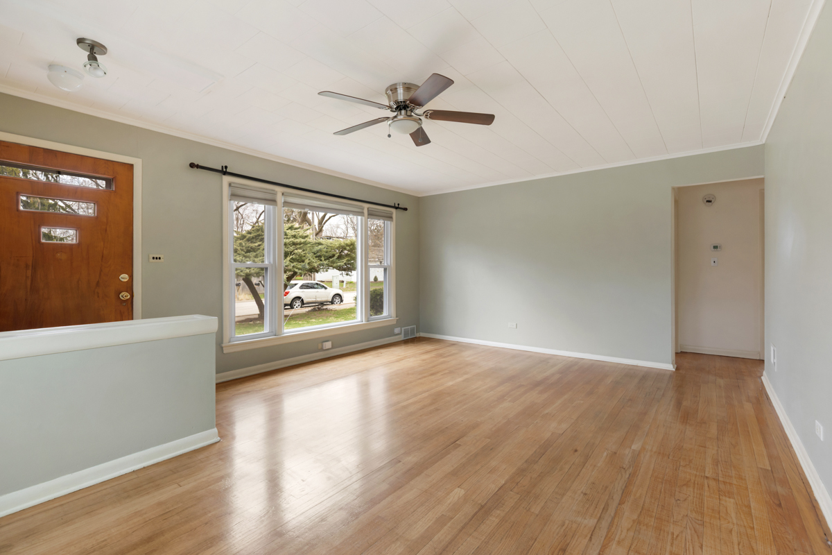 610 High Street Geneva, IL 60134 - Photo 8 of 18 an empty room with wooden floor fan and windows