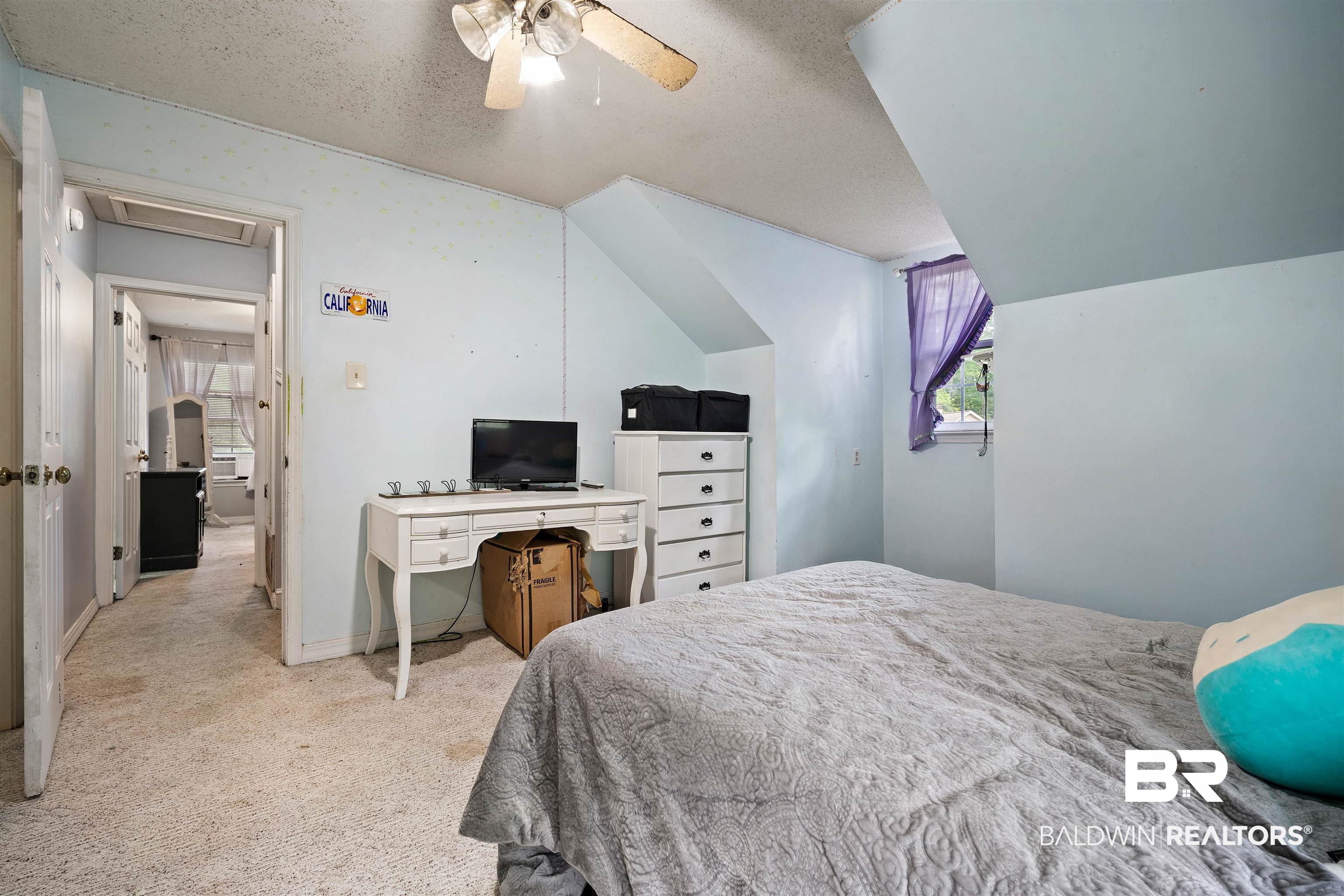 2823 Woodland Road Mobile, AL 36693 - Photo 16 of 29 Bedroom with light colored carpet, lofted ceiling, a ceiling fan, and a textured ceiling