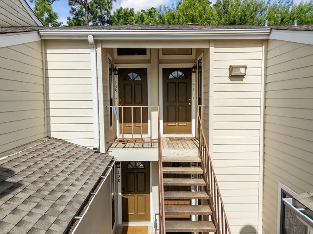 an outdoor view of house with deck