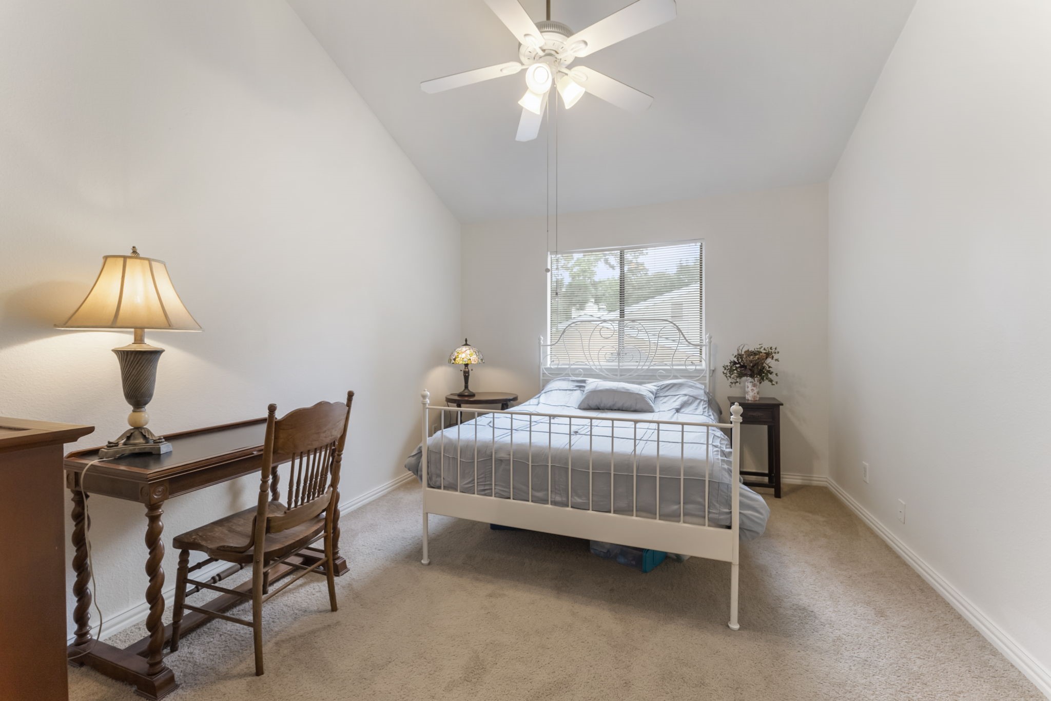 3500 Tangle Brush Drive, Unit 139 Spring, TX 77381 - Photo 10 of 22 a bedroom with a bed and a chandelier
