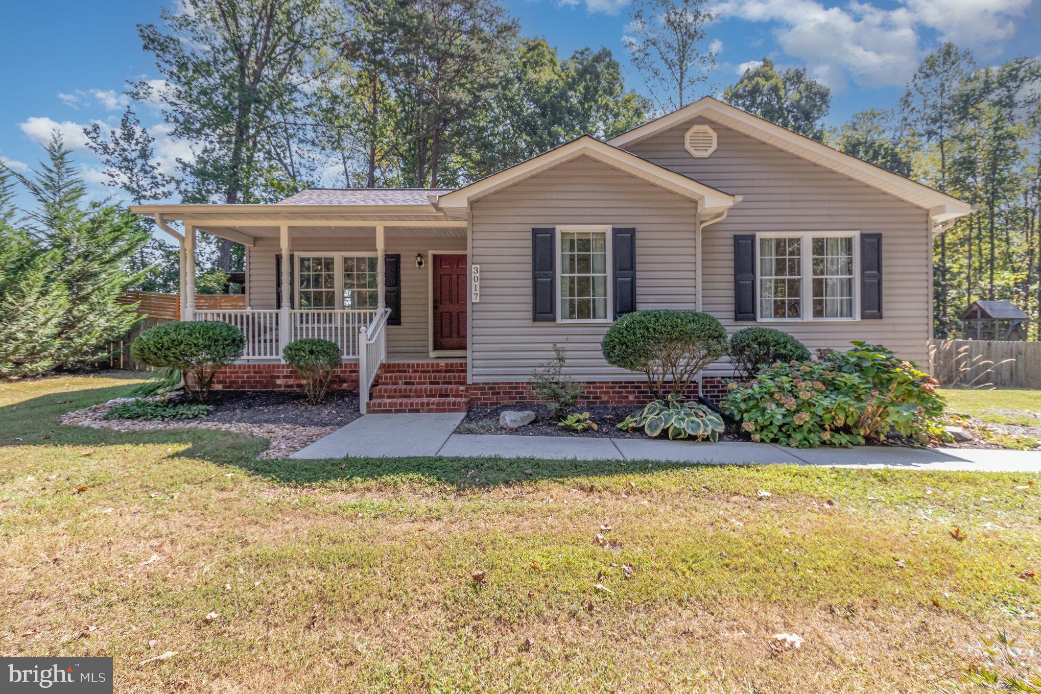 3017 Minor Road Bumpass, VA 23024 - Photo 1 of 1 a front view of a house with a yard and porch