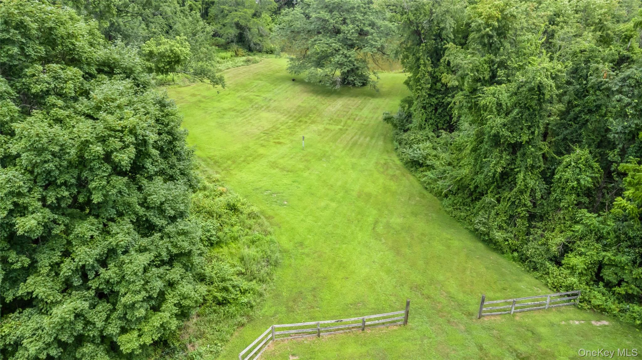 93 Widmer Road Wappingers Falls, NY 12590 - Photo 44 of 45 Original pasture area going down to the pond, partial wood fencing