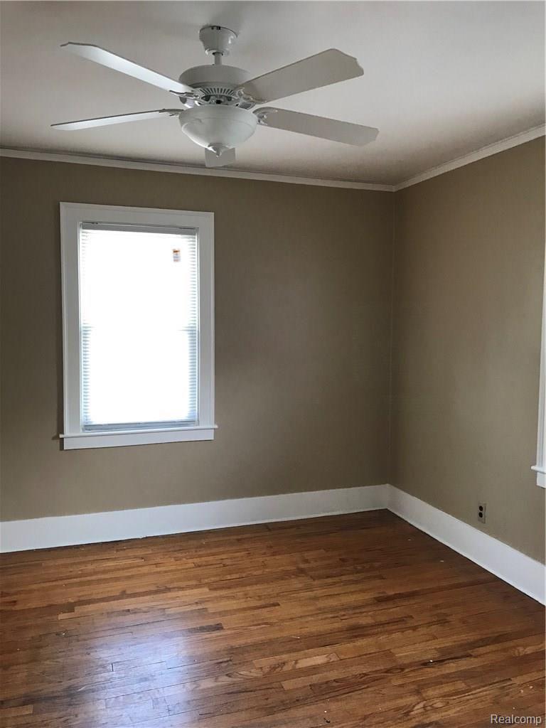 35804 John R Street Wayne, MI 48184 - Photo 11 of 80 lovely hardwoods in the bedroom with vinyl windows, overhead remote controlled fan, and professional paint finish!