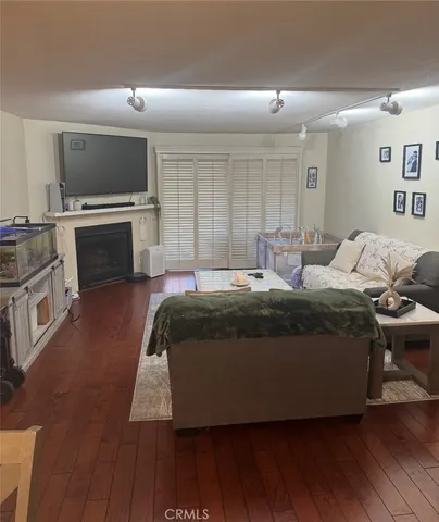 a bedroom with a bed and a television