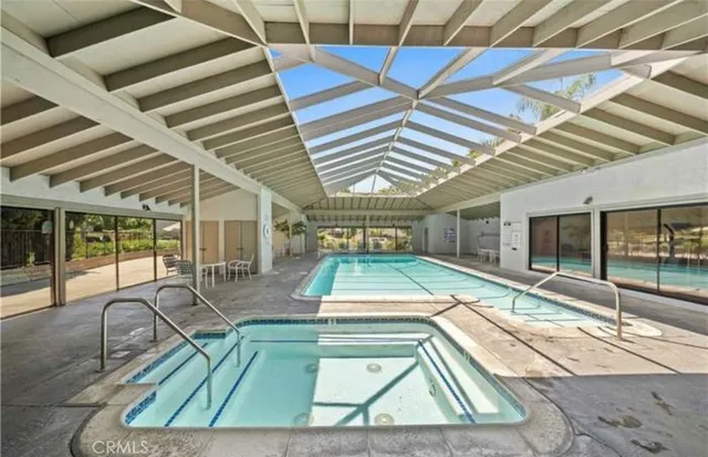 a view of a swimming pool with a patio