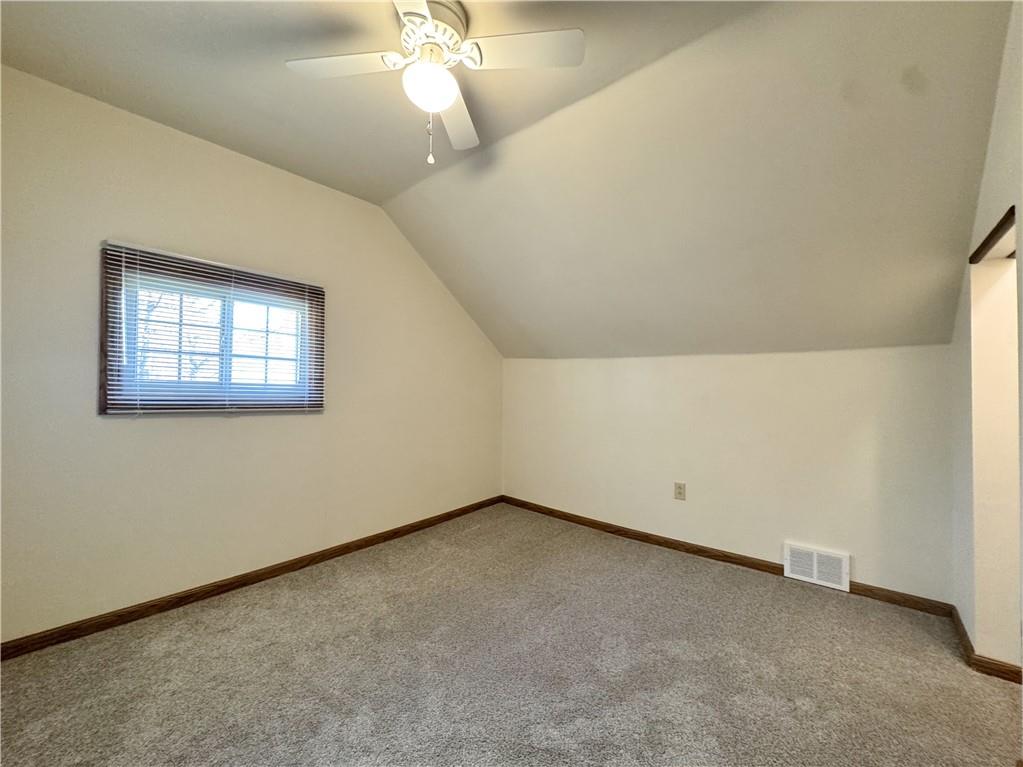 618 New Castle Road Butler, PA 16001 - Photo 12 of 23 an empty room with a chandelier fan
