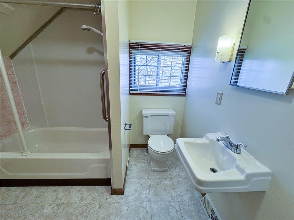 618 New Castle Road Butler, PA 16001 - Photo 15 of 23 a bathroom with a sink a toilet and bathtub
