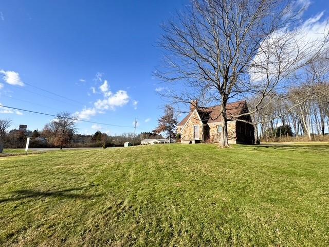 618 New Castle Road Butler, PA 16001 - Photo 2 of 23 a big yard with lots of green space and palm trees