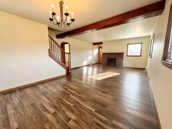 a view or livingroom with hardwood floor and a ceiling fan