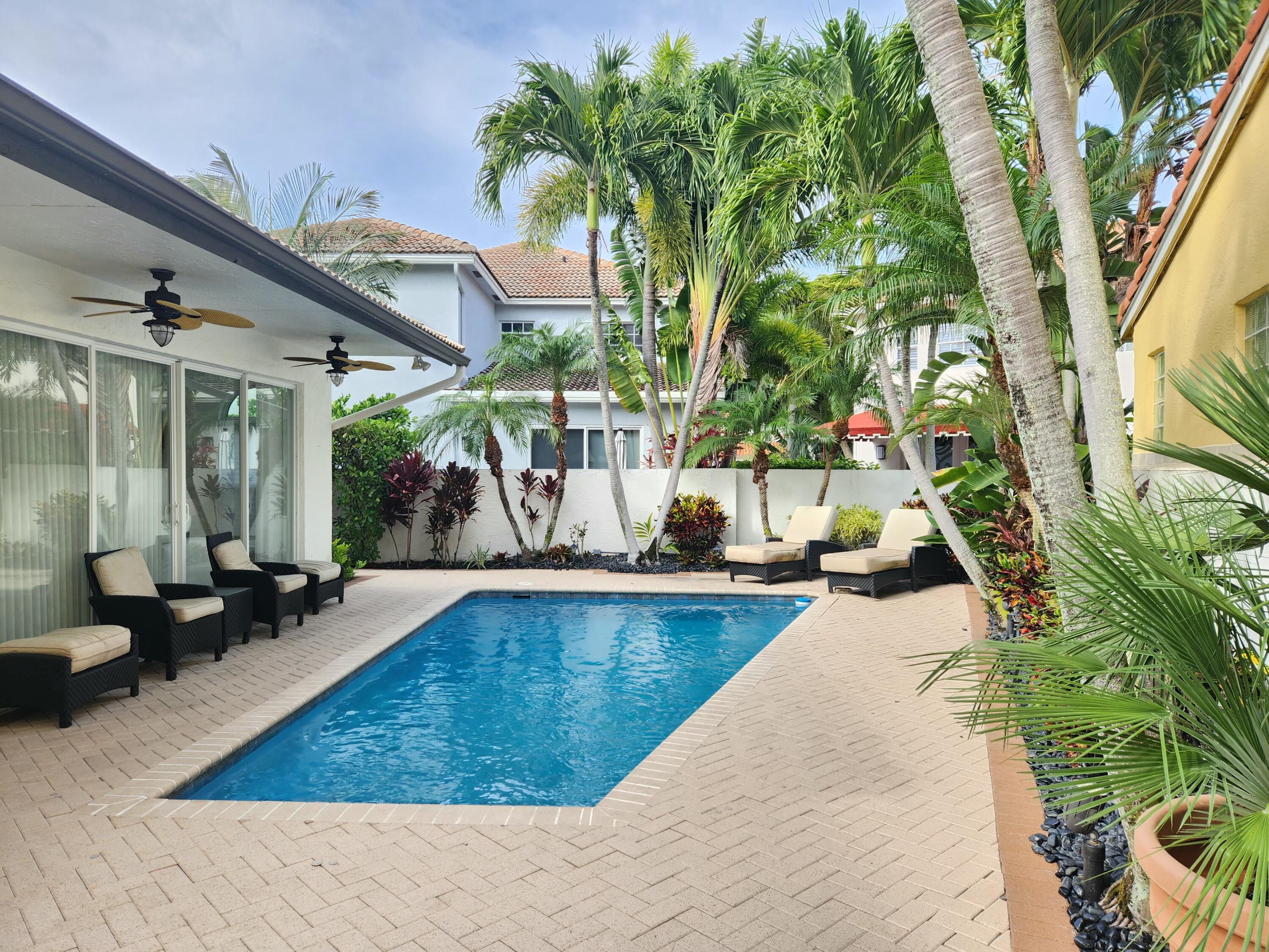 3567 Commodore Circle Delray Beach, FL 33483 - Photo 50 of 76 swimming pool with outdoor seating and patio