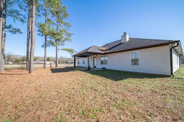 a backyard of a house with lots of green space