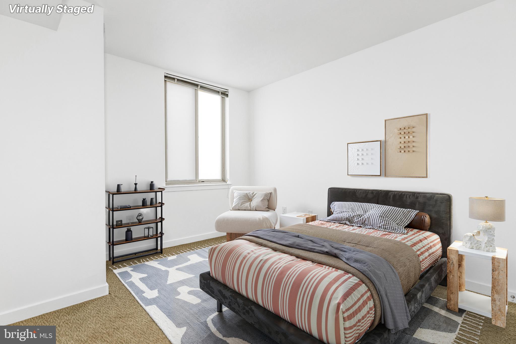 1000 New Jersey Avenue Southeast, Unit 608 Washington, DC 20003 - Photo 14 of 28 a bedroom with a bed and a window