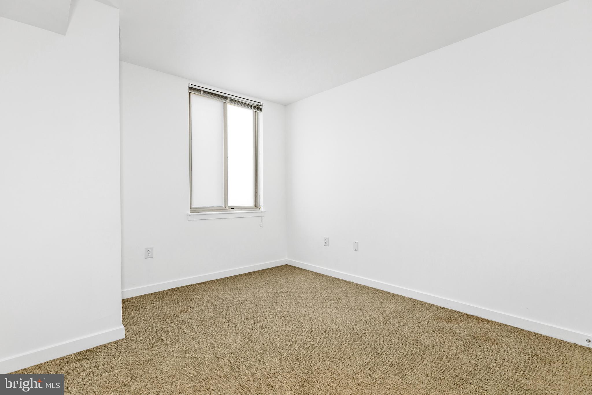 1000 New Jersey Avenue Southeast, Unit 608 Washington, DC 20003 - Photo 15 of 28 an empty room with a window