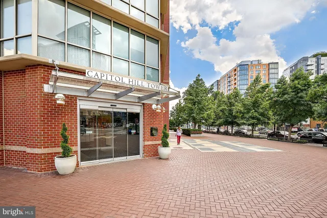 a room with gym equipment and a view of living room
