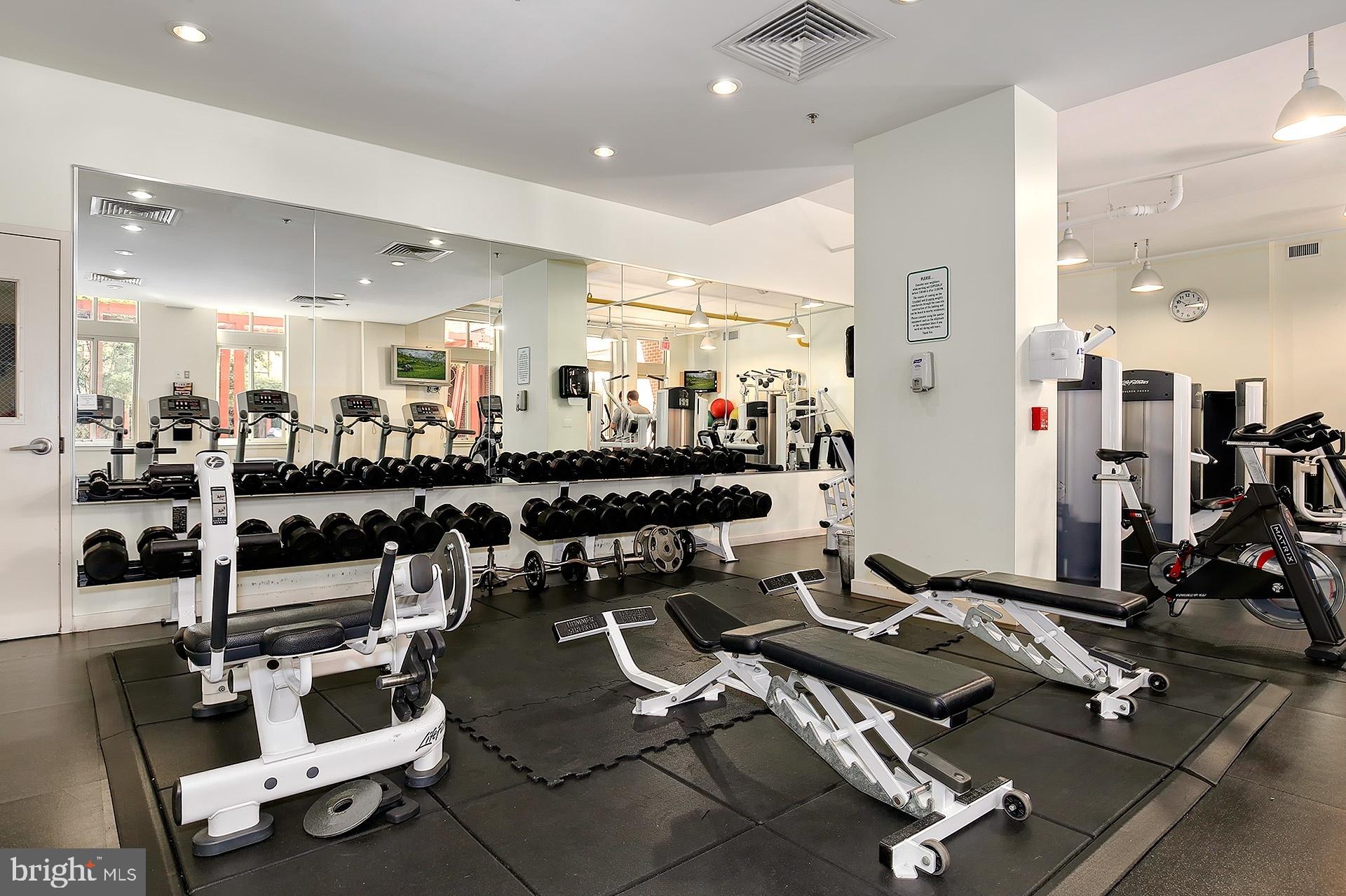 1000 New Jersey Avenue Southeast, Unit 608 Washington, DC 20003 - Photo 20 of 28 a room with gym equipment and a view of living room
