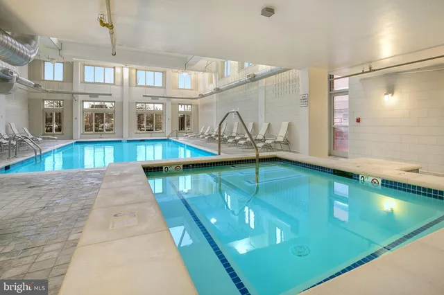 a view of swimming pool with outdoor seating