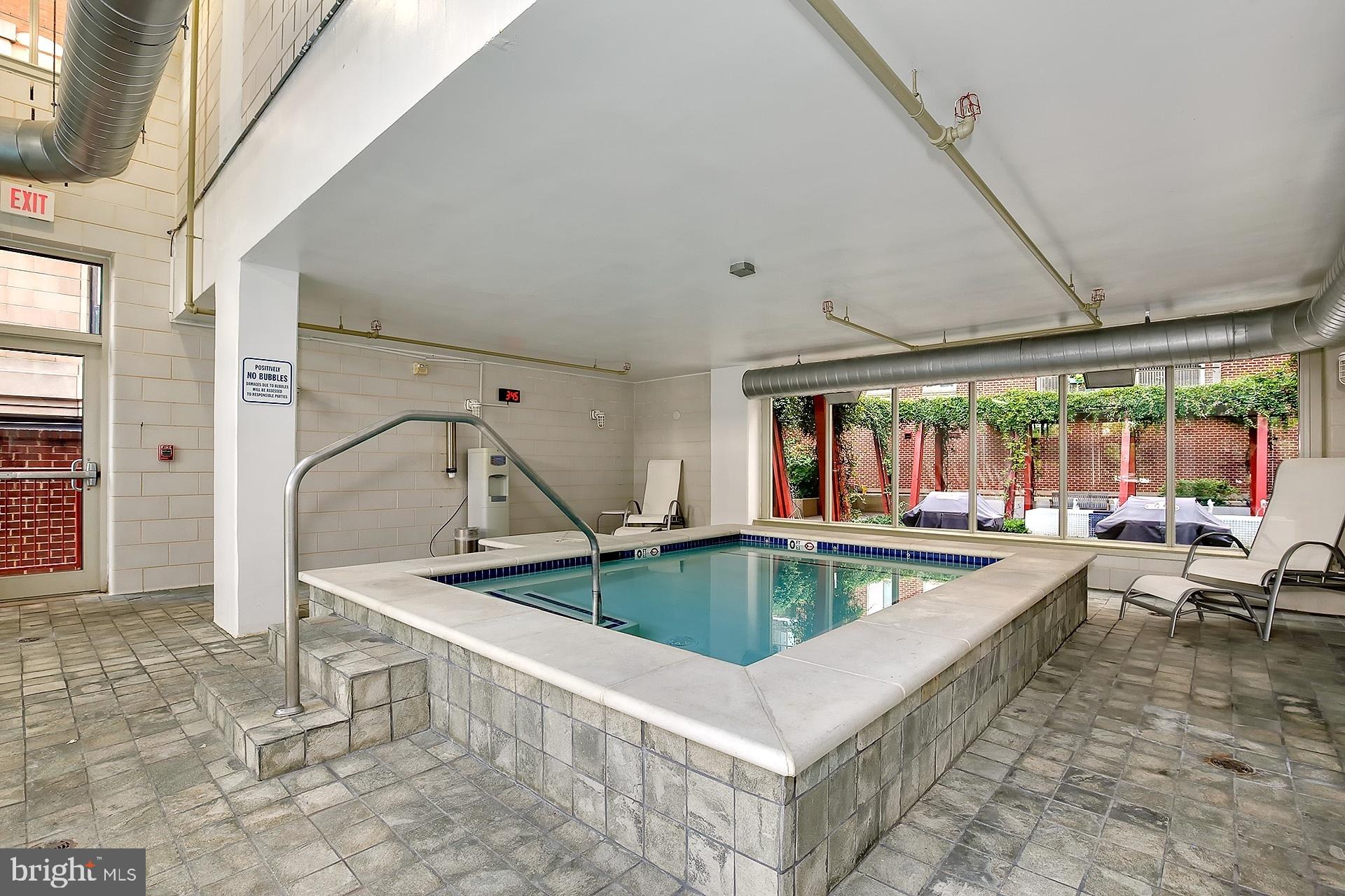 1000 New Jersey Avenue Southeast, Unit 608 Washington, DC 20003 - Photo 25 of 28 a view of swimming pool with outdoor seating