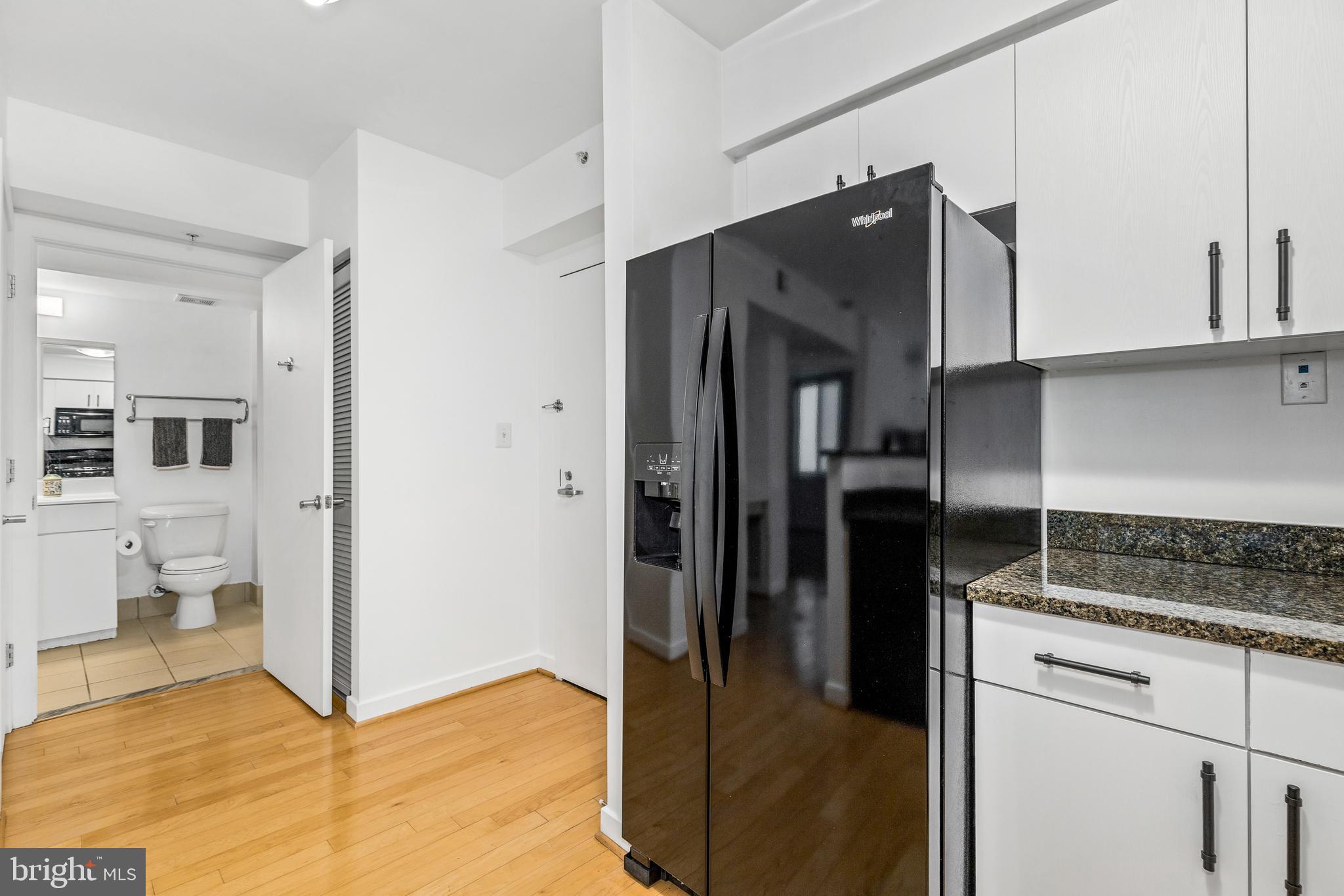 1000 New Jersey Avenue Southeast, Unit 608 Washington, DC 20003 - Photo 4 of 28 a kitchen with stainless steel appliances granite countertop a refrigerator and a stove