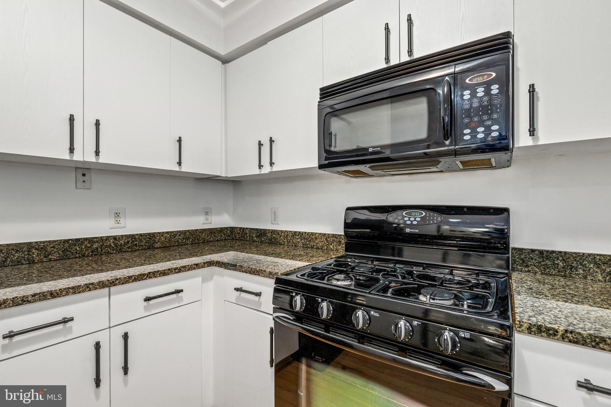 1000 New Jersey Avenue Southeast, Unit 608 Washington, DC 20003 - Photo 6 of 28 a kitchen with stainless steel appliances a sink a stove and cabinets