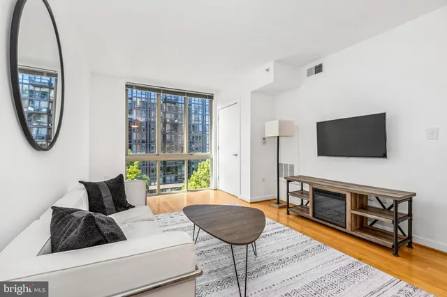 a living room with furniture and a window