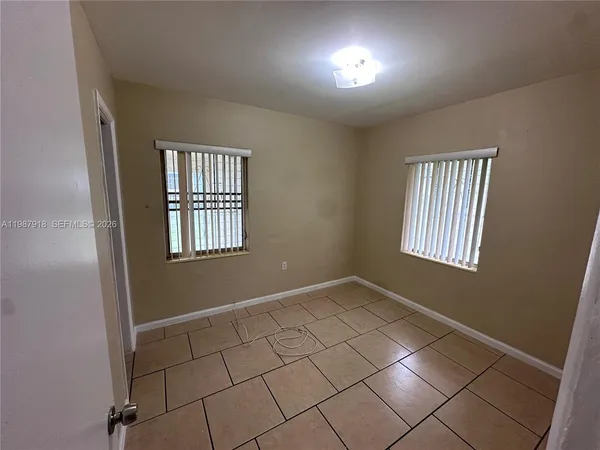 an empty room with windows