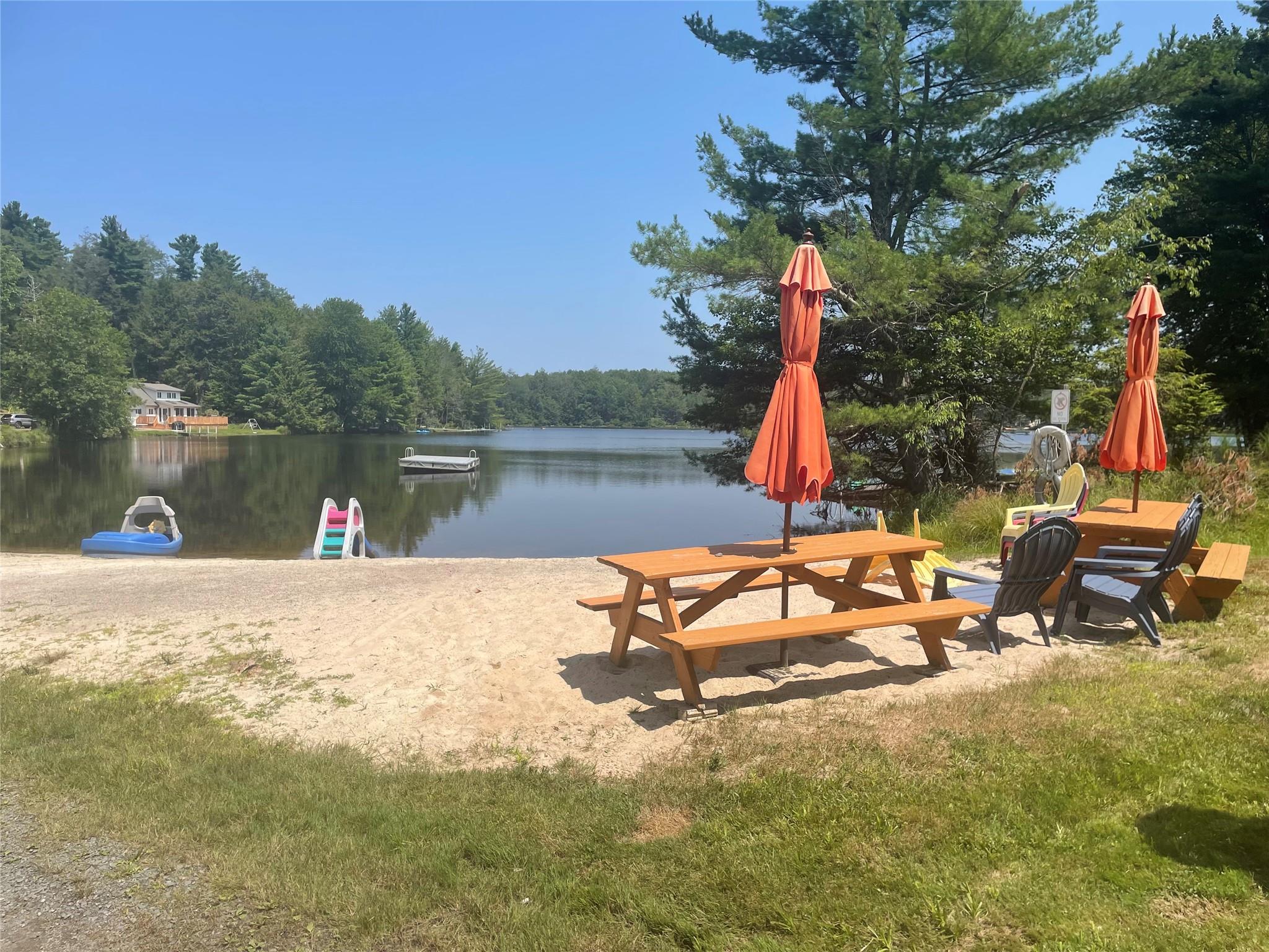 126 Beaver Lake Road Rock Hill, NY 12775 - Photo 4 of 8 a view of a lake with a sitting area
