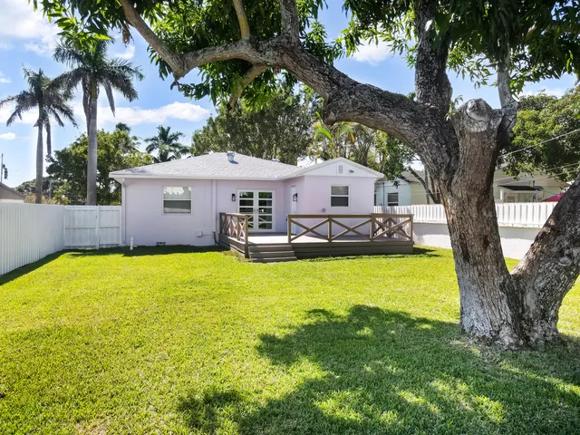 a swimming pool view with a outdoor seating