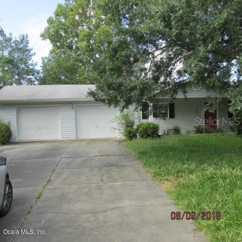 6200 Southwest 103rd Street Road Ocala, FL 34476 - Photo 1 of 1 a front view of house with a garden