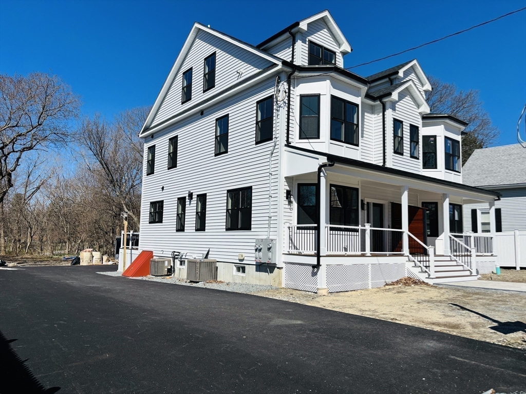 19 Maverick Street, Unit 19 Dedham, MA 02026 - Photo 13 of 13 a front view of a building with street