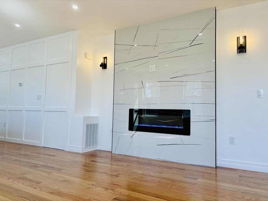 19 Maverick Street, Unit 19 Dedham, MA 02026 - Photo 3 of 13 a view of a livingroom with wooden floor
