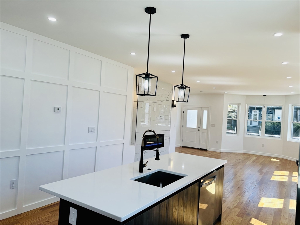 19 Maverick Street, Unit 19 Dedham, MA 02026 - Photo 5 of 13 a view of a room with furniture and wooden floor