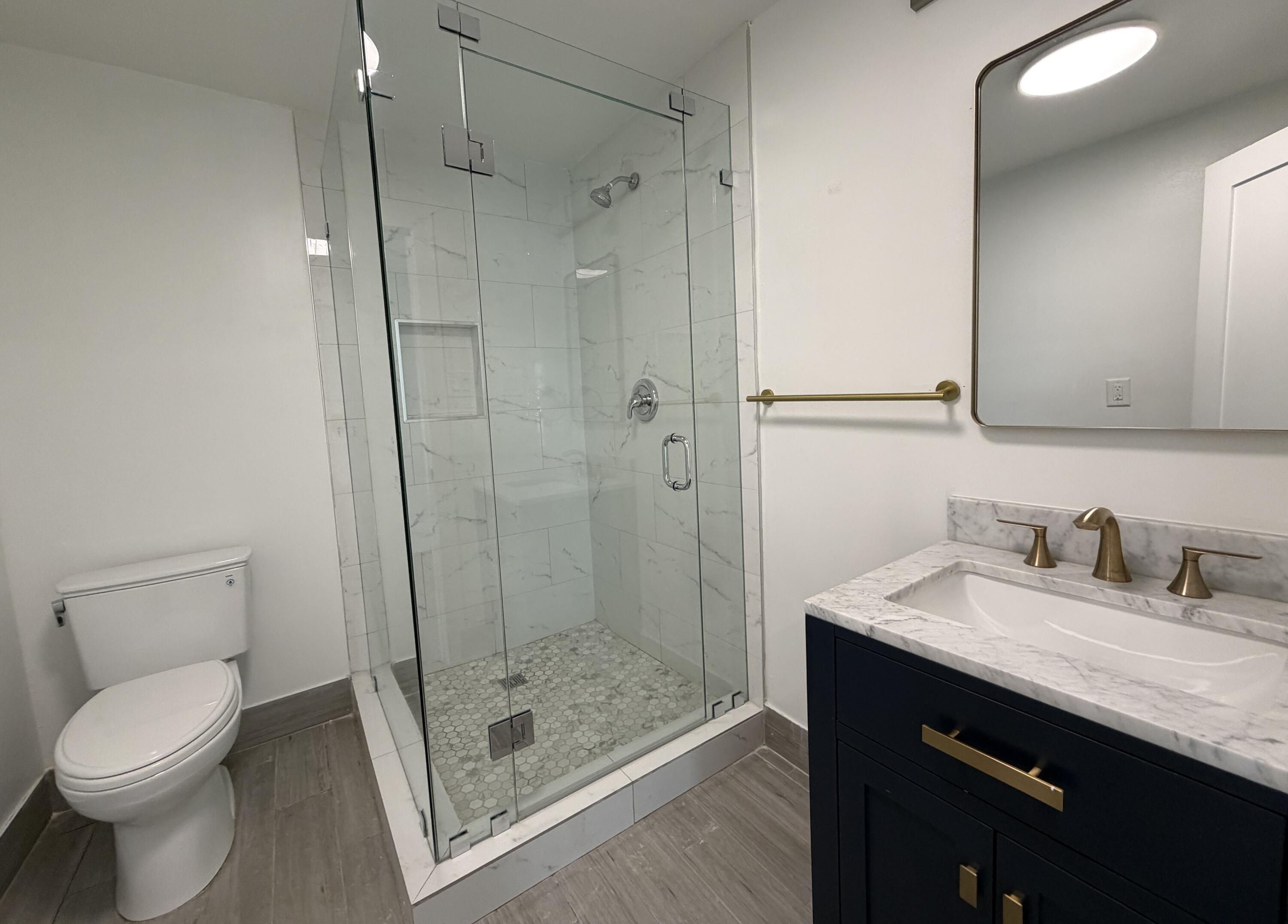 29656 Constitution Avenue Big Pine Key, FL 33043 - Photo 11 of 19 a bathroom with a granite countertop sink toilet and shower