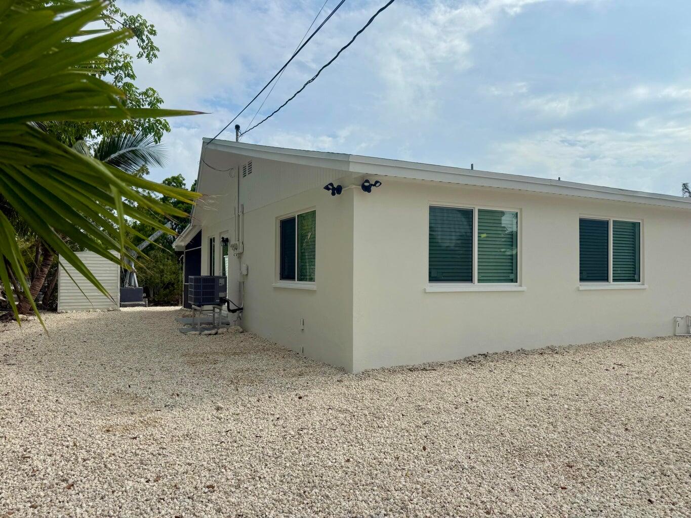29656 Constitution Avenue Big Pine Key, FL 33043 - Photo 18 of 19 a view of a house with a tree
