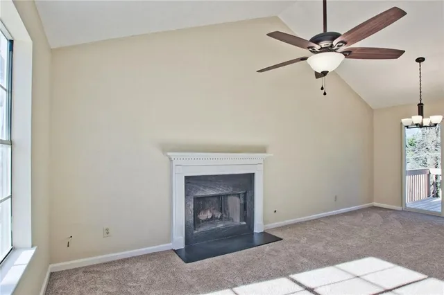 a living room with a fireplace and a window