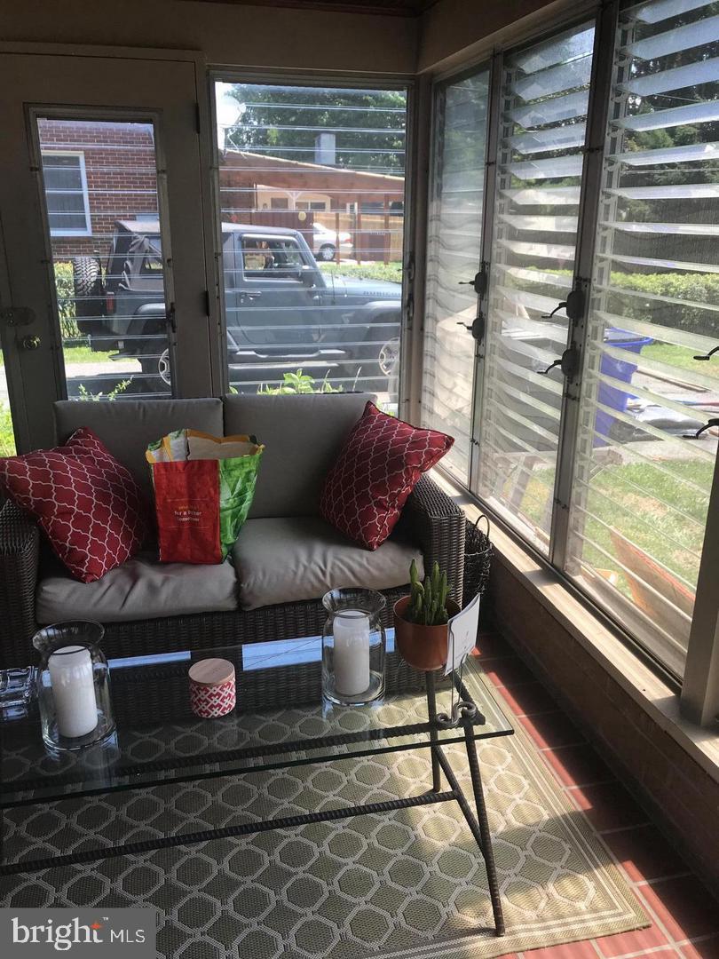 112 Fairview Avenue Frederick, MD 21701 - Photo 13 of 24 a living room with furniture and a window