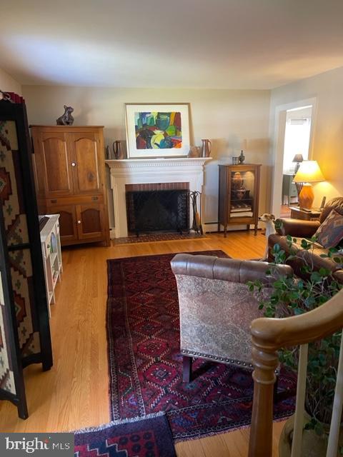 112 Fairview Avenue Frederick, MD 21701 - Photo 2 of 24 a living room with furniture and a fireplace