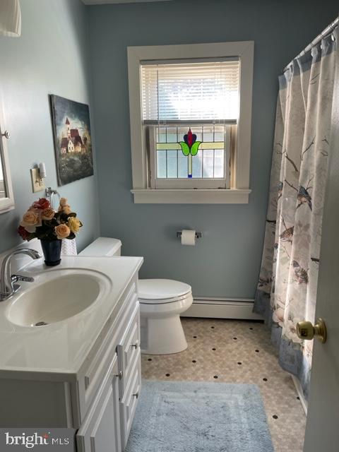 112 Fairview Avenue Frederick, MD 21701 - Photo 21 of 24 a bathroom with a sink toilet and a mirror
