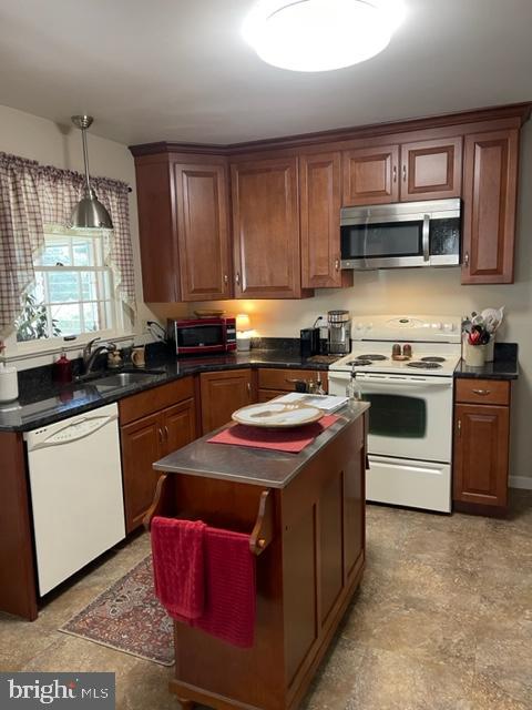 112 Fairview Avenue Frederick, MD 21701 - Photo 4 of 24 a kitchen with stainless steel appliances a sink stove and window