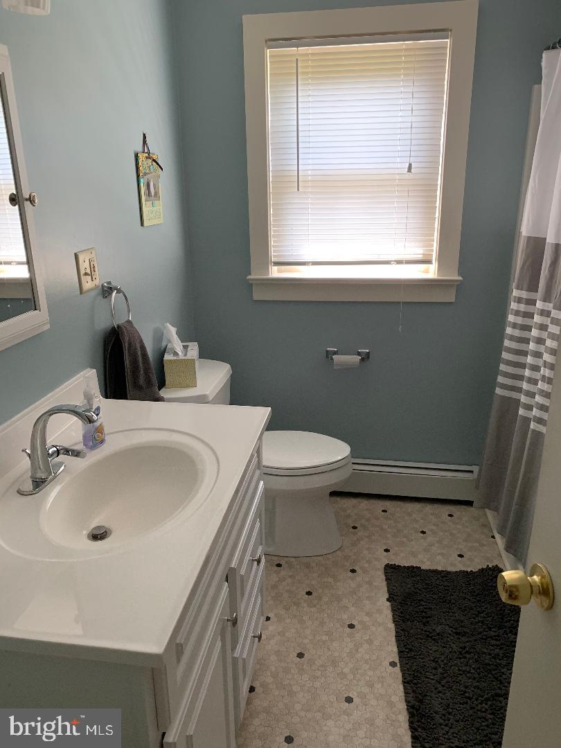 112 Fairview Avenue Frederick, MD 21701 - Photo 5 of 24 a bathroom with a sink and a toilet