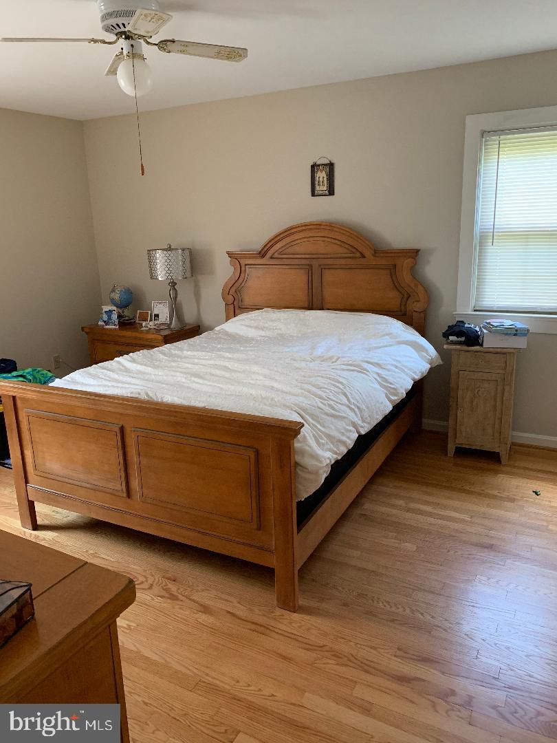 112 Fairview Avenue Frederick, MD 21701 - Photo 6 of 24 a bedroom with a bed and window