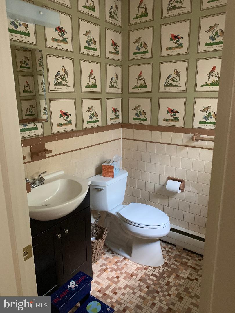 112 Fairview Avenue Frederick, MD 21701 - Photo 7 of 24 a bathroom with a sink a toilet and a window
