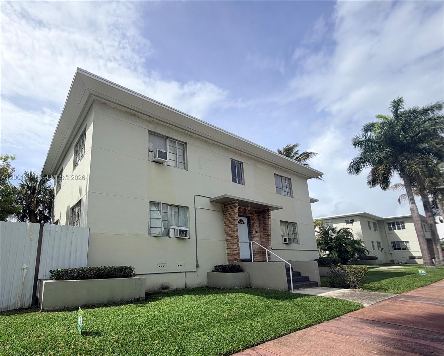620 84th Street, Unit 25 Miami Beach, FL 33141 - Photo 11 of 12 a front view of house with a garden